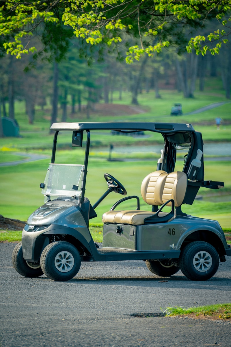 A golf cart sits on a course.